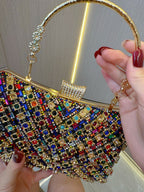 حقيبة يد مزينة بأحجار الراين والخرز اللامع 